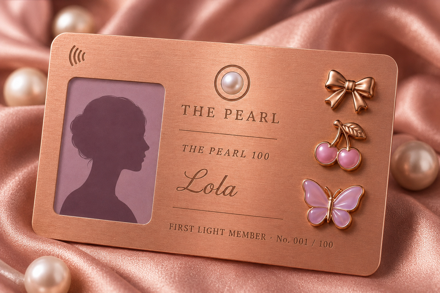 The Pearl 100 rose gold First Light card with charms